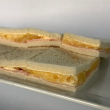 24 Sándwiches de jamón y ananá de copetín