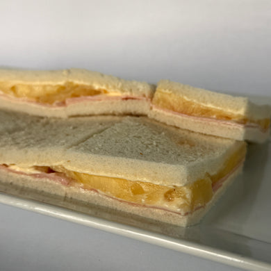 24 Sándwiches de jamón y ananá de copetín